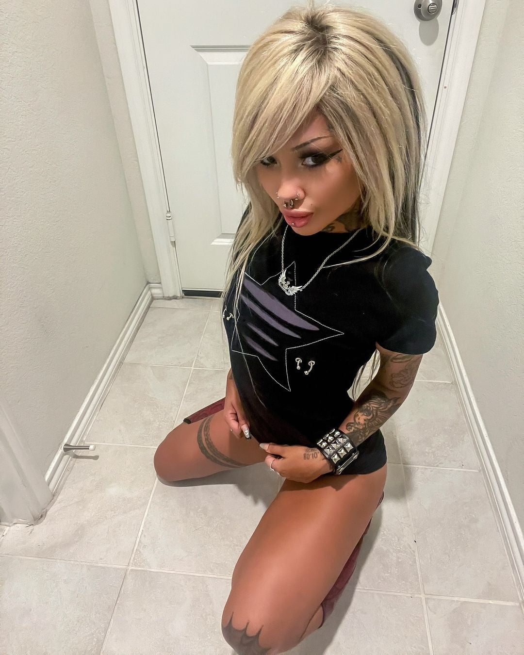 Slashed star piercings baby tee